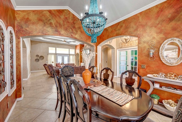 dining space featuring crown molding, baseboards, french doors, a high ceiling, and arched walkways