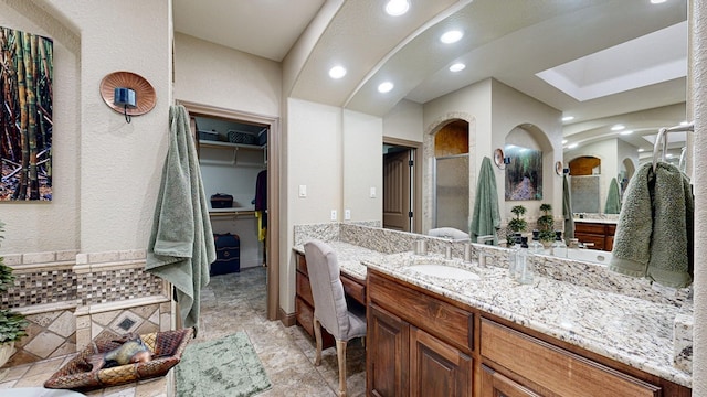 bathroom with vanity and an enclosed shower