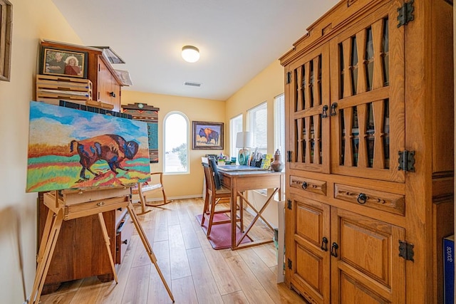 home office with light wood-type flooring