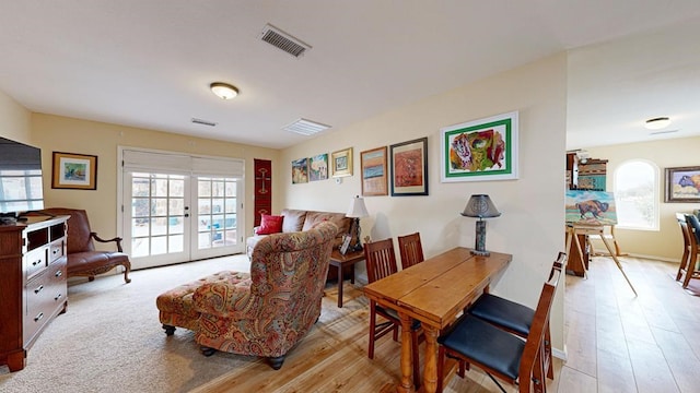 interior space featuring french doors and light wood-type flooring