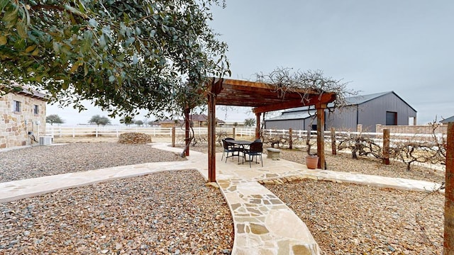 view of yard featuring central AC unit and a patio