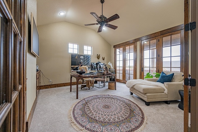 home office featuring lofted ceiling, light colored carpet, ceiling fan, and french doors