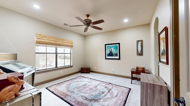 office space with ceiling fan and carpet floors