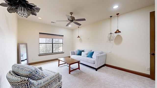 living room featuring ceiling fan and light carpet