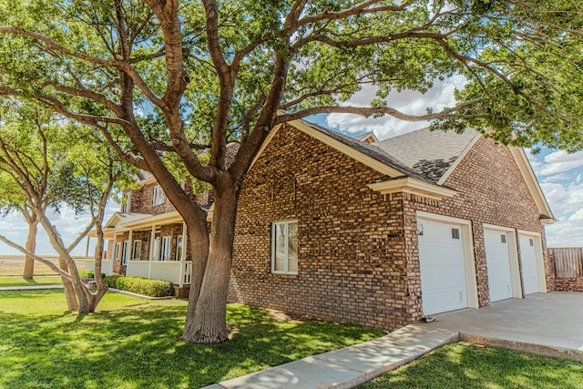 view of front of house with a porch and a front lawn