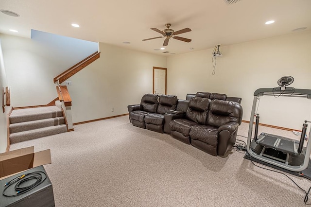 carpeted cinema featuring ceiling fan