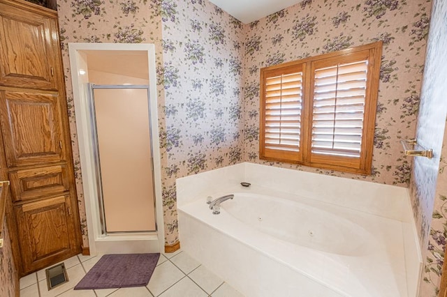 bathroom with tile patterned floors and separate shower and tub