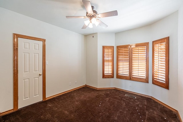 carpeted empty room with ceiling fan