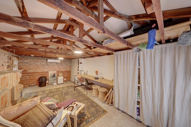 basement with a wall mounted air conditioner and brick wall