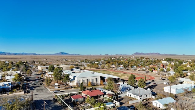 birds eye view of property featuring a mountain view