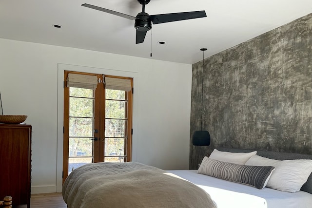 bedroom with wood-type flooring, french doors, and ceiling fan