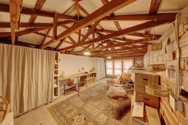 misc room with vaulted ceiling with beams