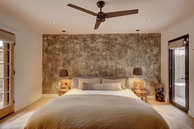 unfurnished bedroom featuring ceiling fan, light hardwood / wood-style flooring, and multiple windows