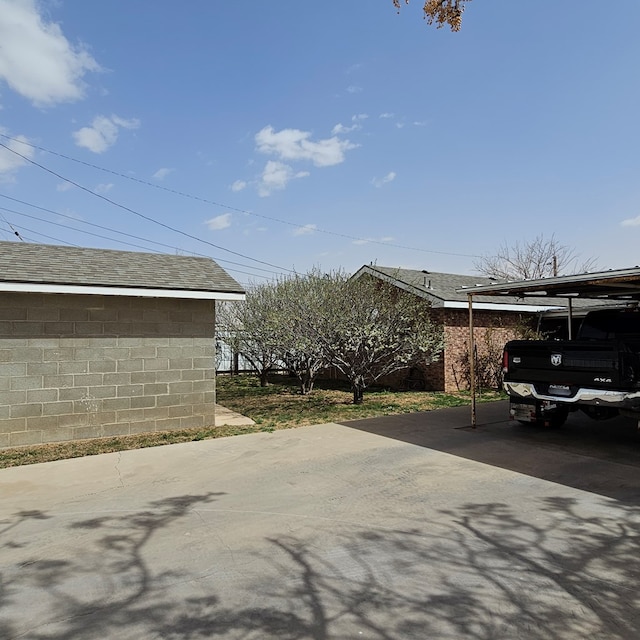 exterior space featuring a carport