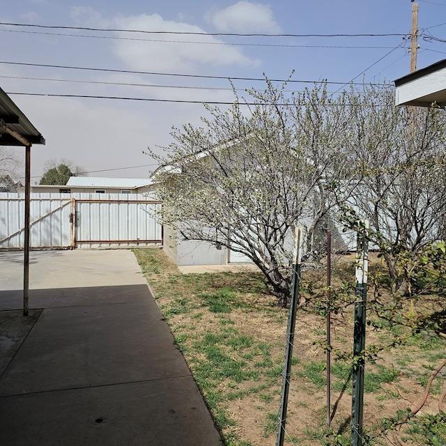 view of yard featuring a patio and fence