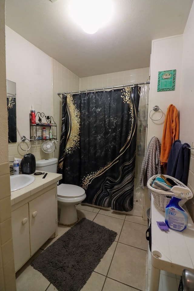 bathroom with walk in shower, tile patterned flooring, vanity, and toilet