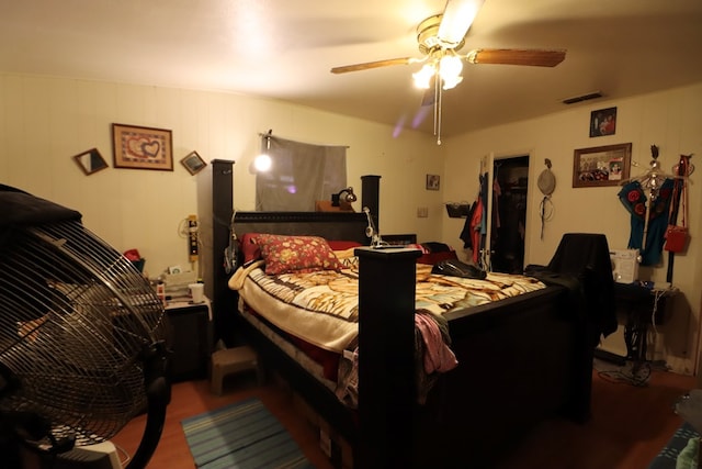 bedroom with hardwood / wood-style flooring and ceiling fan