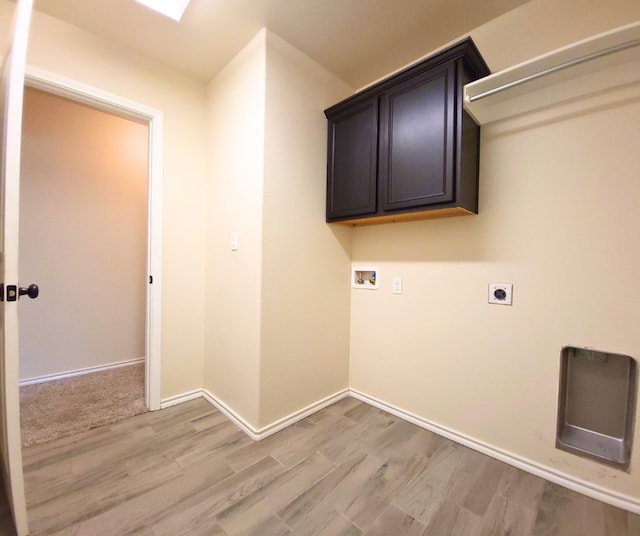 laundry room featuring light wood-type flooring, baseboards, hookup for an electric dryer, and hookup for a washing machine