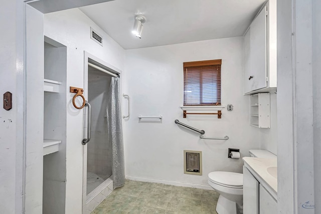 bathroom featuring vanity, a shower with curtain, and toilet