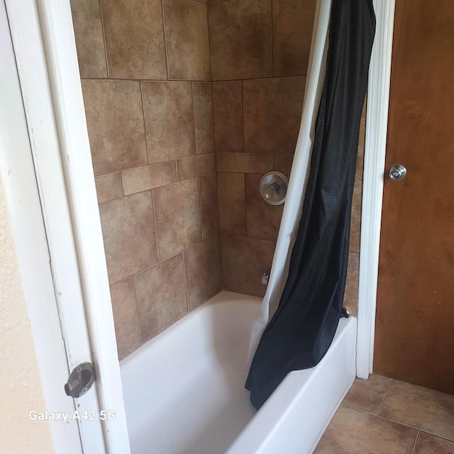 bathroom with tile patterned flooring and shower / tub combo with curtain