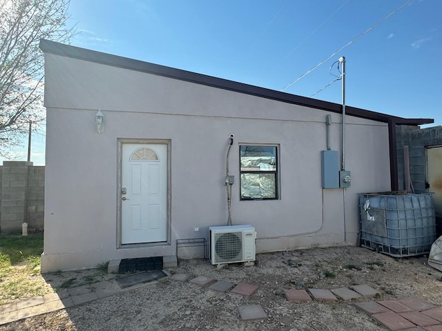 rear view of house with ac unit