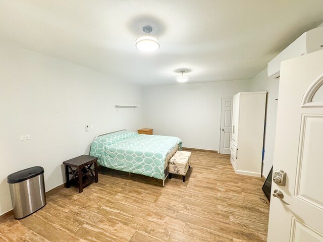 bedroom with light wood-type flooring