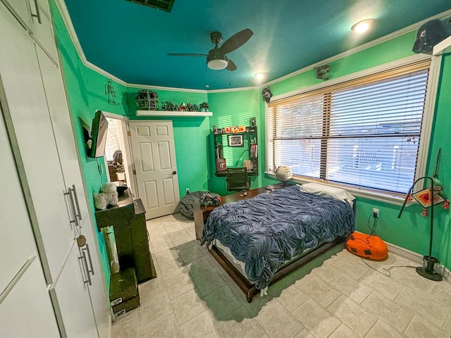 tiled bedroom with ceiling fan and ornamental molding