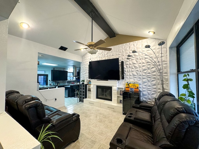 living room with lofted ceiling with beams and ceiling fan