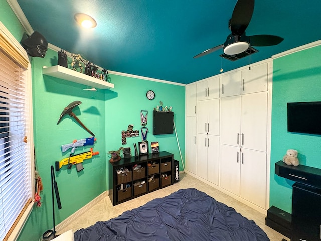 tiled bedroom with a closet, ceiling fan, and ornamental molding