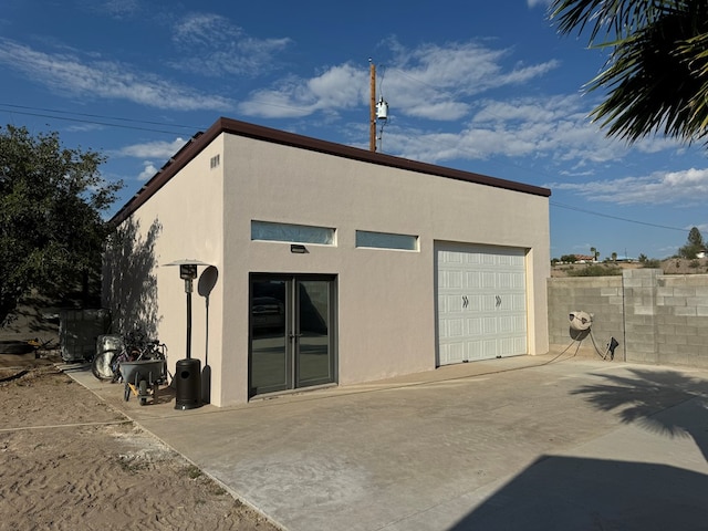 exterior space featuring an outbuilding and a garage