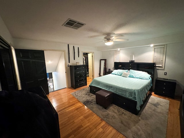 bedroom with ceiling fan and light wood-type flooring