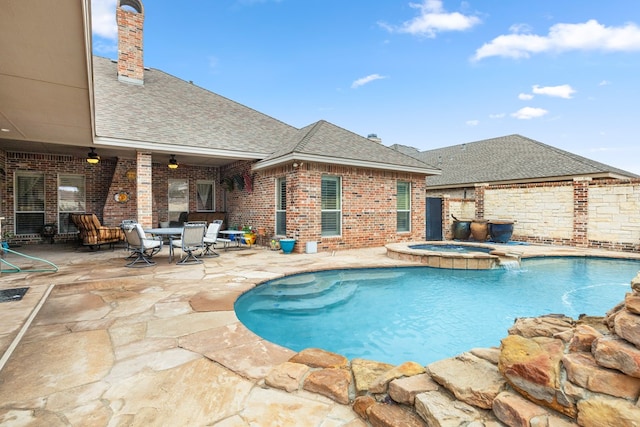 view of pool featuring ceiling fan, an in ground hot tub, and a patio