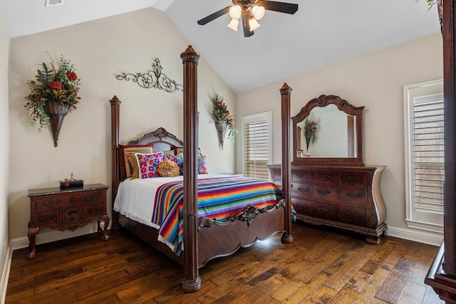 bedroom with ceiling fan, dark hardwood / wood-style floors, and vaulted ceiling