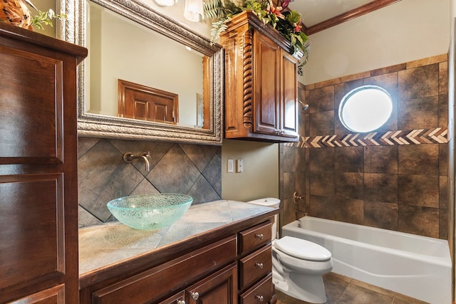 full bathroom with shower / bathing tub combination, vanity, decorative backsplash, toilet, and crown molding