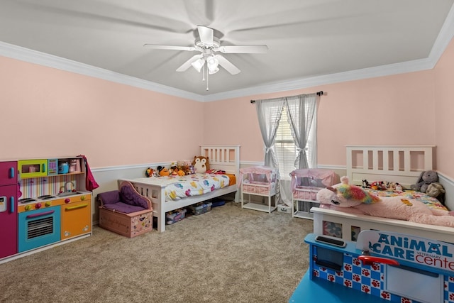 bedroom with ceiling fan, crown molding, and carpet floors