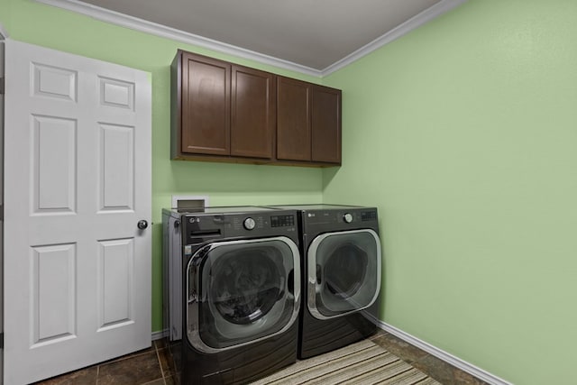 washroom with cabinets, separate washer and dryer, and crown molding