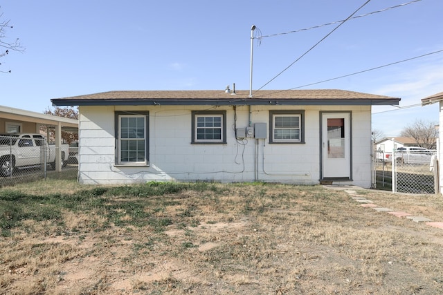 rear view of house with a lawn