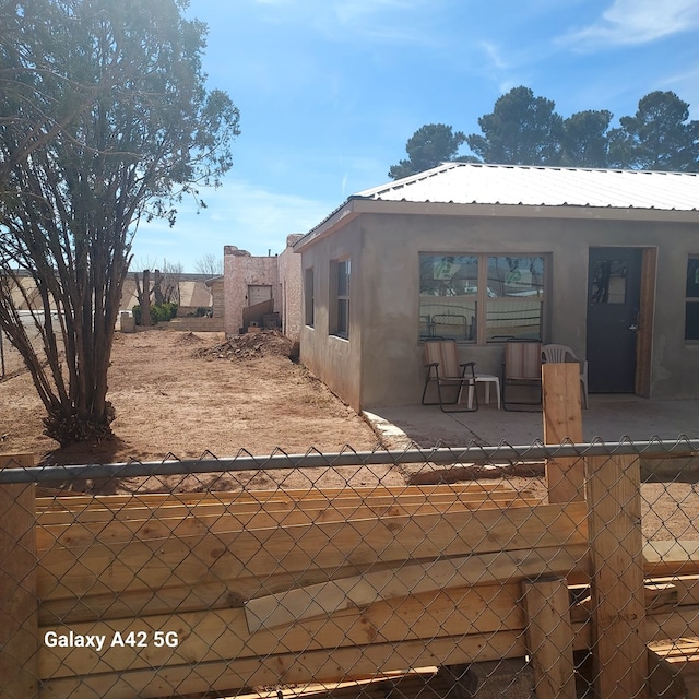 view of patio featuring fence