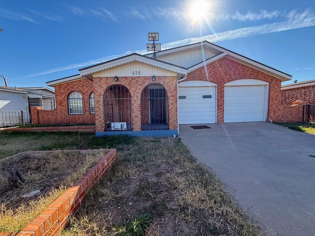 view of front of property with a garage