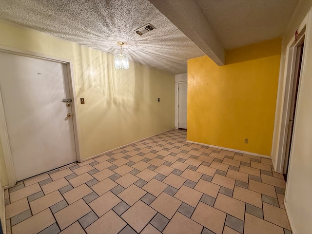 basement with a textured ceiling