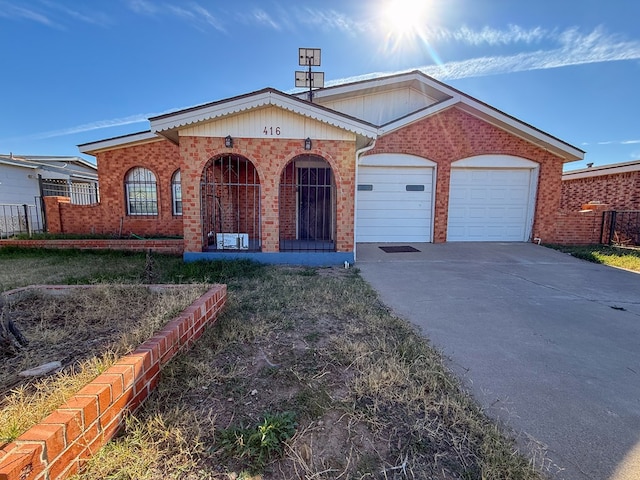 ranch-style house with covered porch and a garage