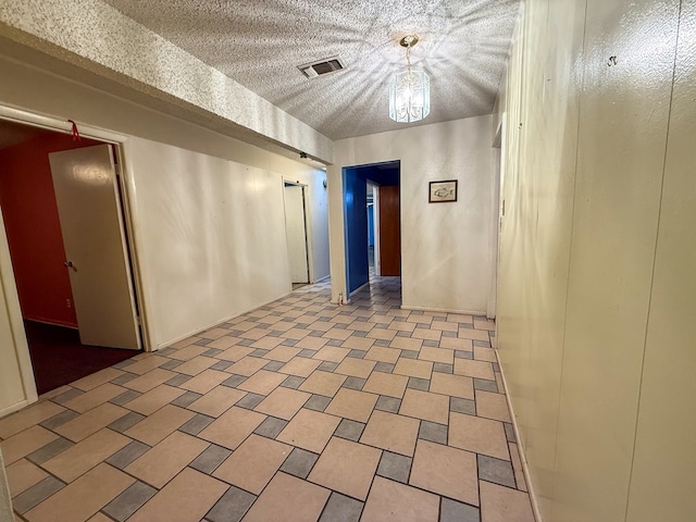 empty room with a textured ceiling