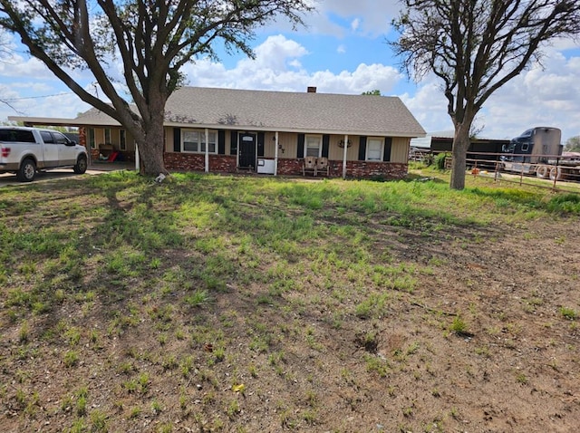 ranch-style home with a carport