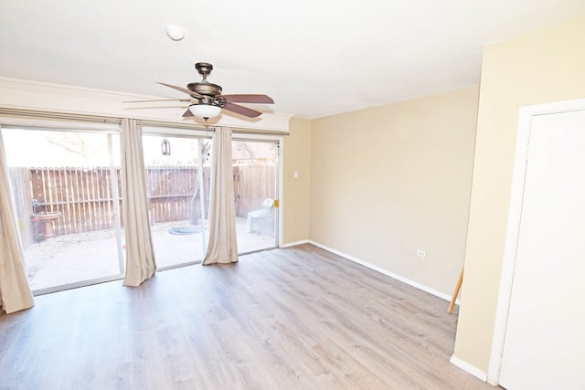 empty room featuring ceiling fan and light wood-type flooring