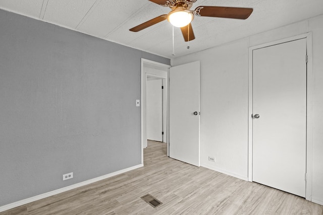 unfurnished bedroom featuring ceiling fan and light wood-type flooring