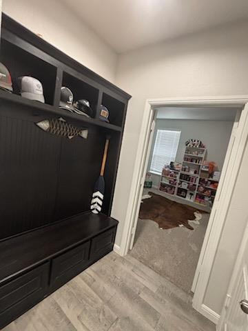 mudroom with light wood finished floors