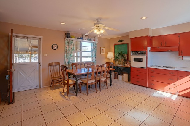 tiled dining area with ceiling fan and a wealth of natural light