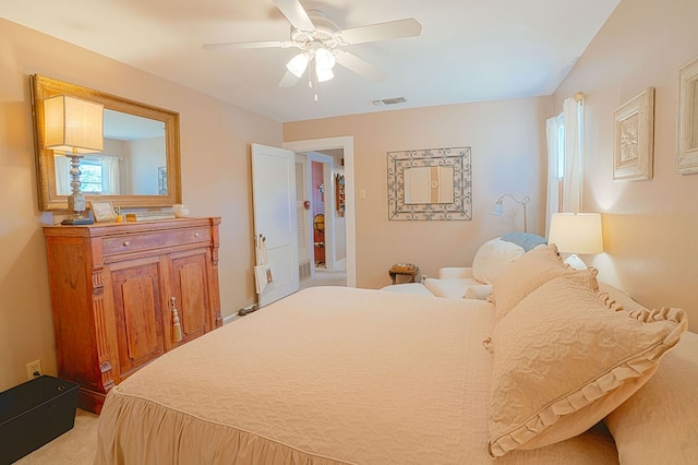 bedroom with ceiling fan and light colored carpet