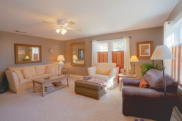 living room with carpet flooring and ceiling fan