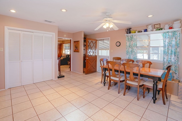 tiled dining room with ceiling fan